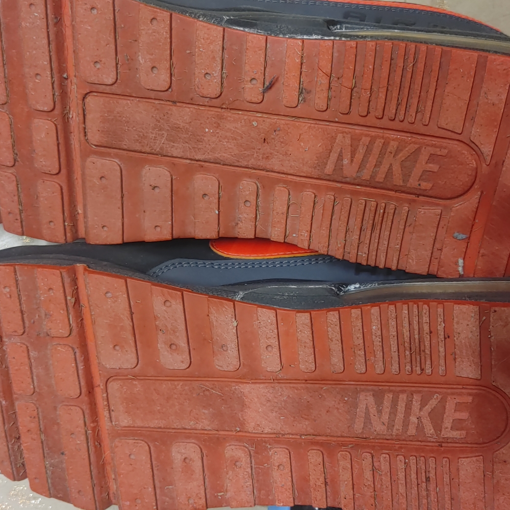 Nike Orange and Black Athletic Shoes with Enhanced Traction